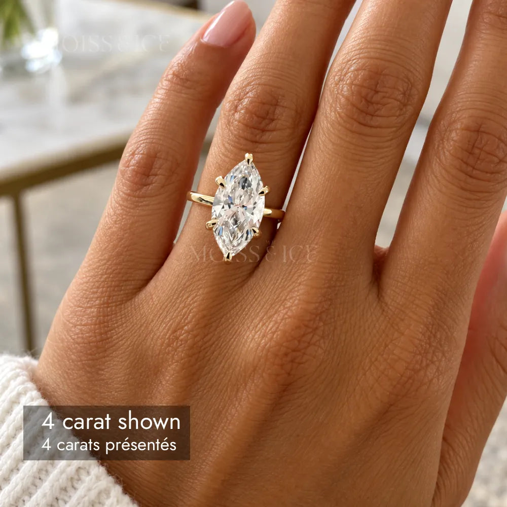 woman wearing 4 carat marquise cut moissanite engagement ring in white gold by Moiss and Ice Canada