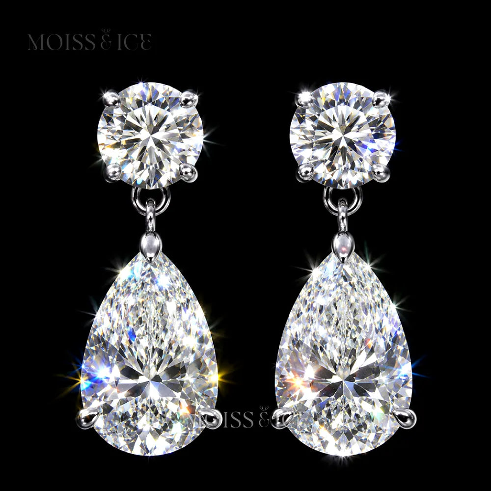A pair of sparkling Moiss & Ice pear drop earrings featuring round brilliant-cut moissanite studs and pear-cut moissanite drops in white gold settings.
