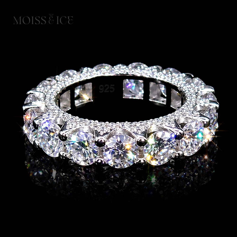 Elegant eternity ring with sparkling moissanite stones by Moiss & Ice Canada. Set in 925 silver, finished with in 18k gold .
