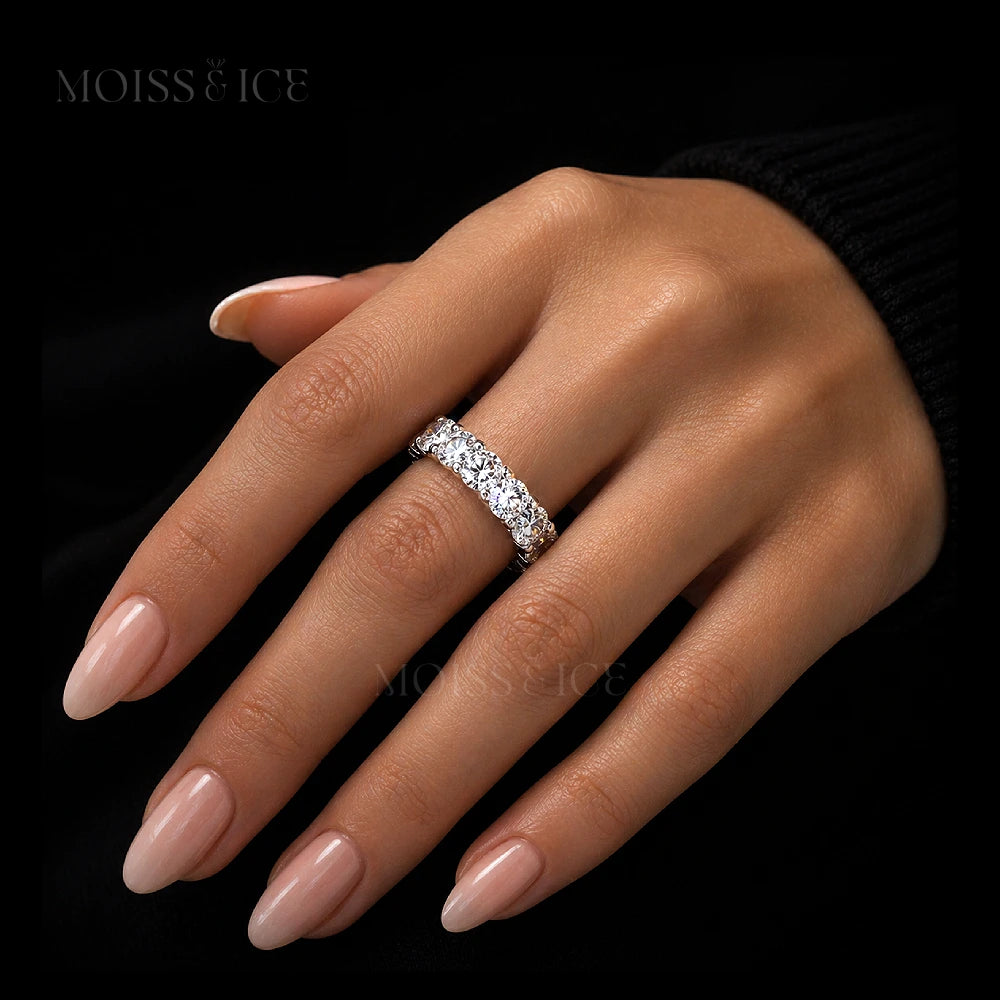 close up of a female hand wearing round cut eternity moissanite ring from Moiss and Ice Canada - model the Pyaar