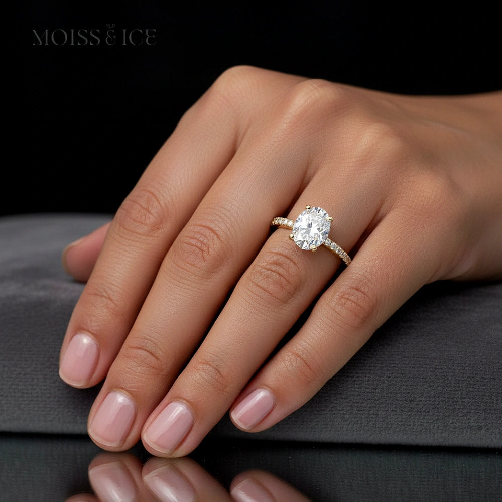 oval cut moissanite engagement gold ring by Moiss and Ice Canada - heera model on a female hand