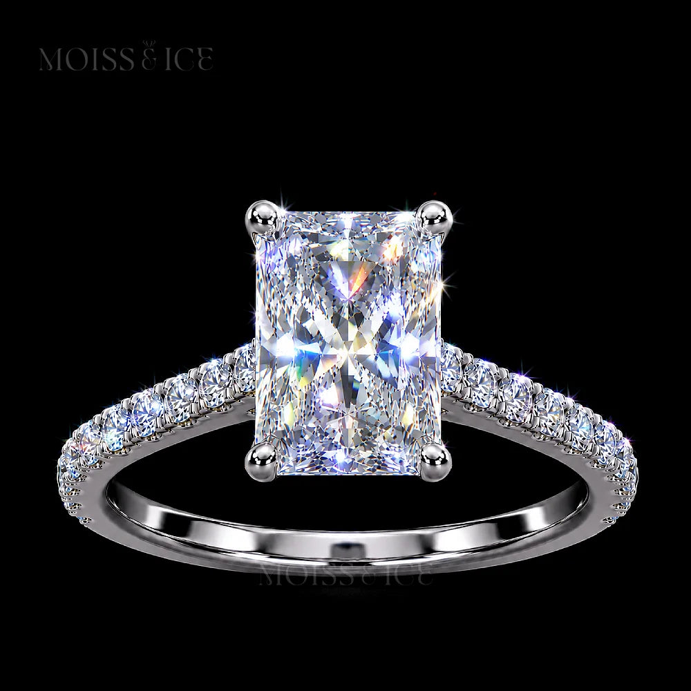 Radiant cut white gold Moissanite Engagement Ring with a hidden halo, diamond bridge and Pave band. The Aavya Moiss and Ice Canada