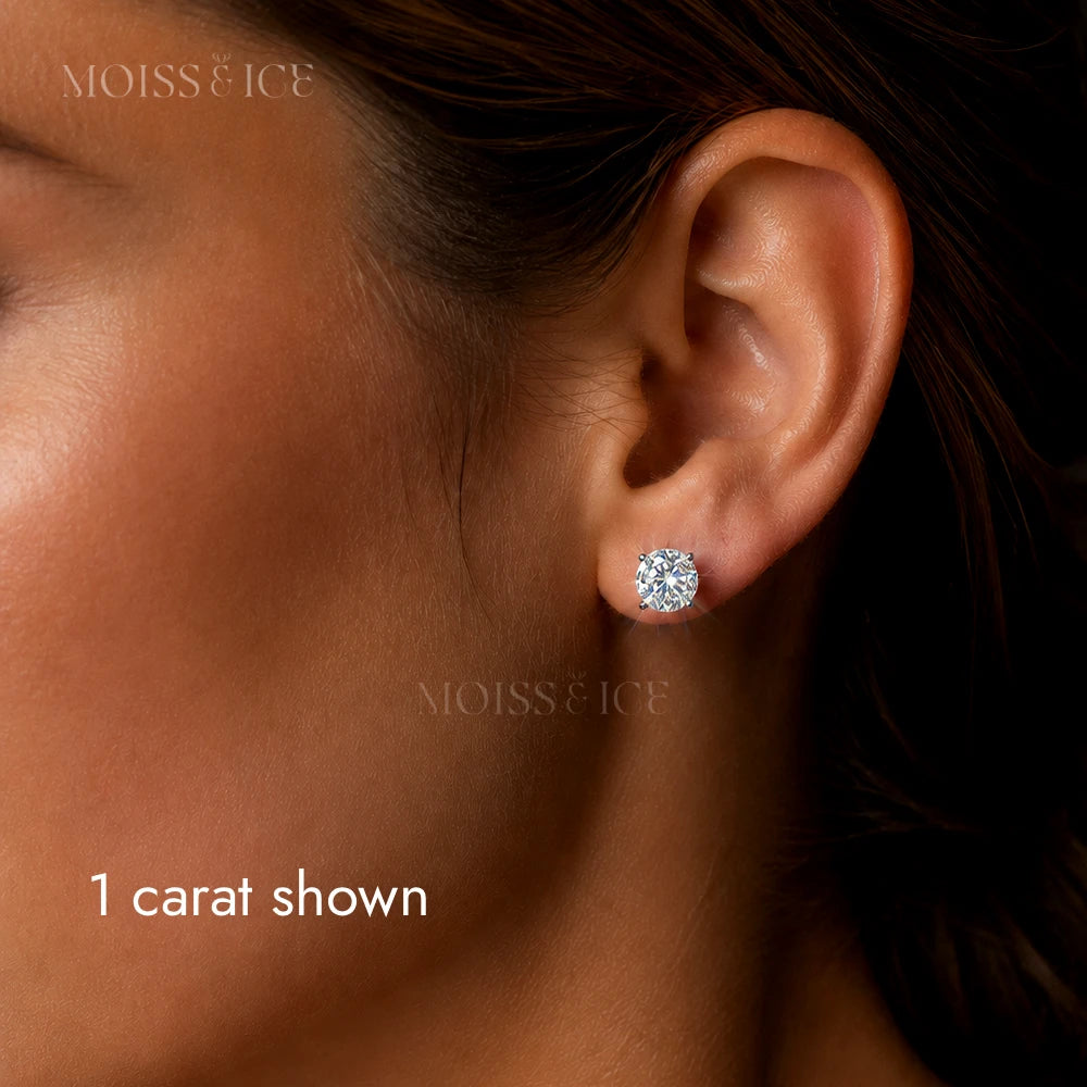 A close up of a Woman wearing sparkling 1 carat moissanite round stud earrings by Moiss and Ice Canada
