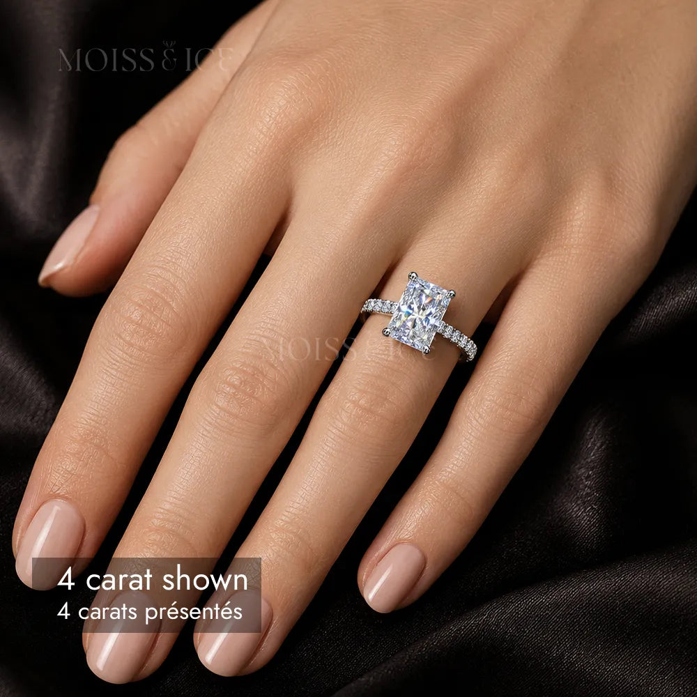 close up of a woman wearing a 4 carat radiant cut moissanite engagement ring with a pave band, hidden halo and bridge by Moiss and Ice Canada
