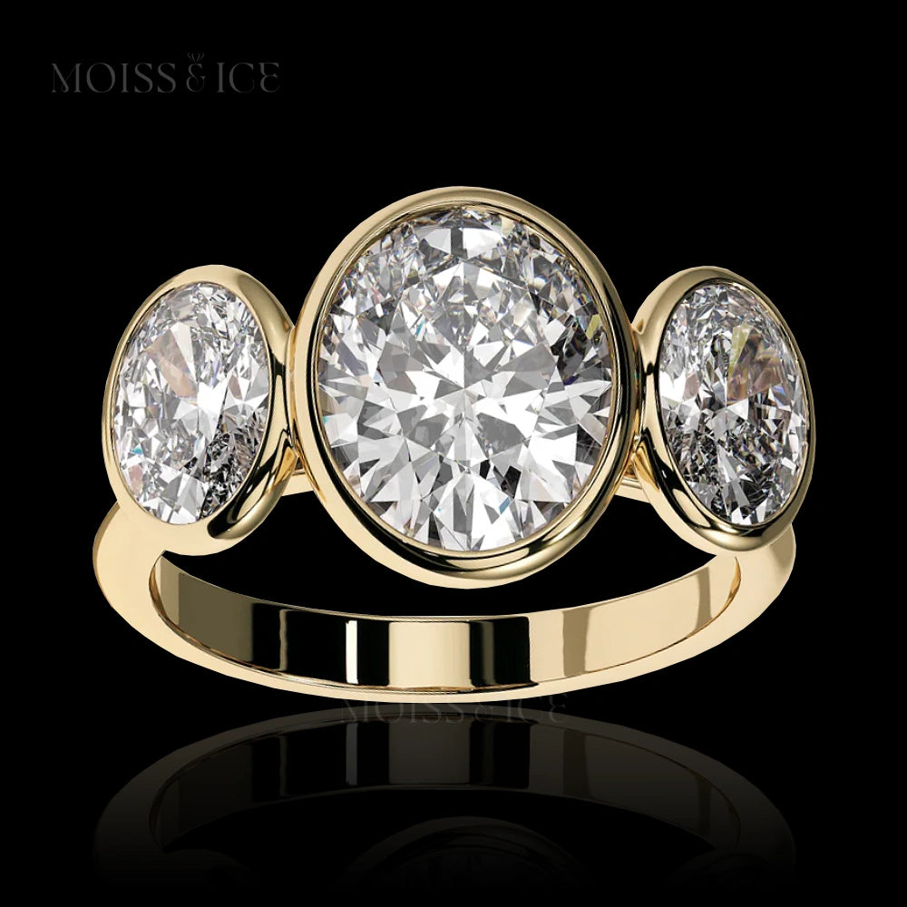 Yellow Gold Oval 3 Stone Trilogy Moissanite Engagement Ring called the KAHANI by Moiss & Ice Canada