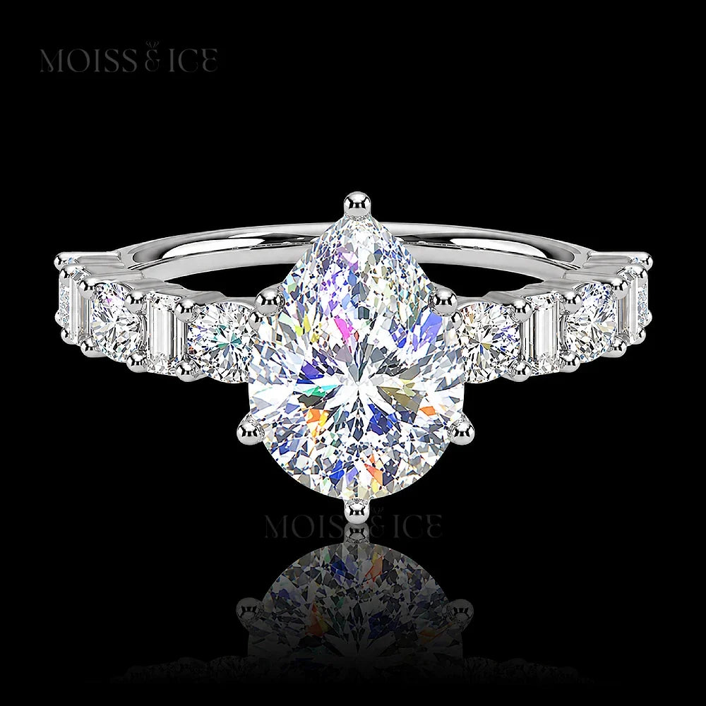 pear cut moissanite engagement ring with a pavé band of alternating baguette and round cut moissanite  stones in 14k and 18k white gold - The Chahat by Moiss and Ice Canada