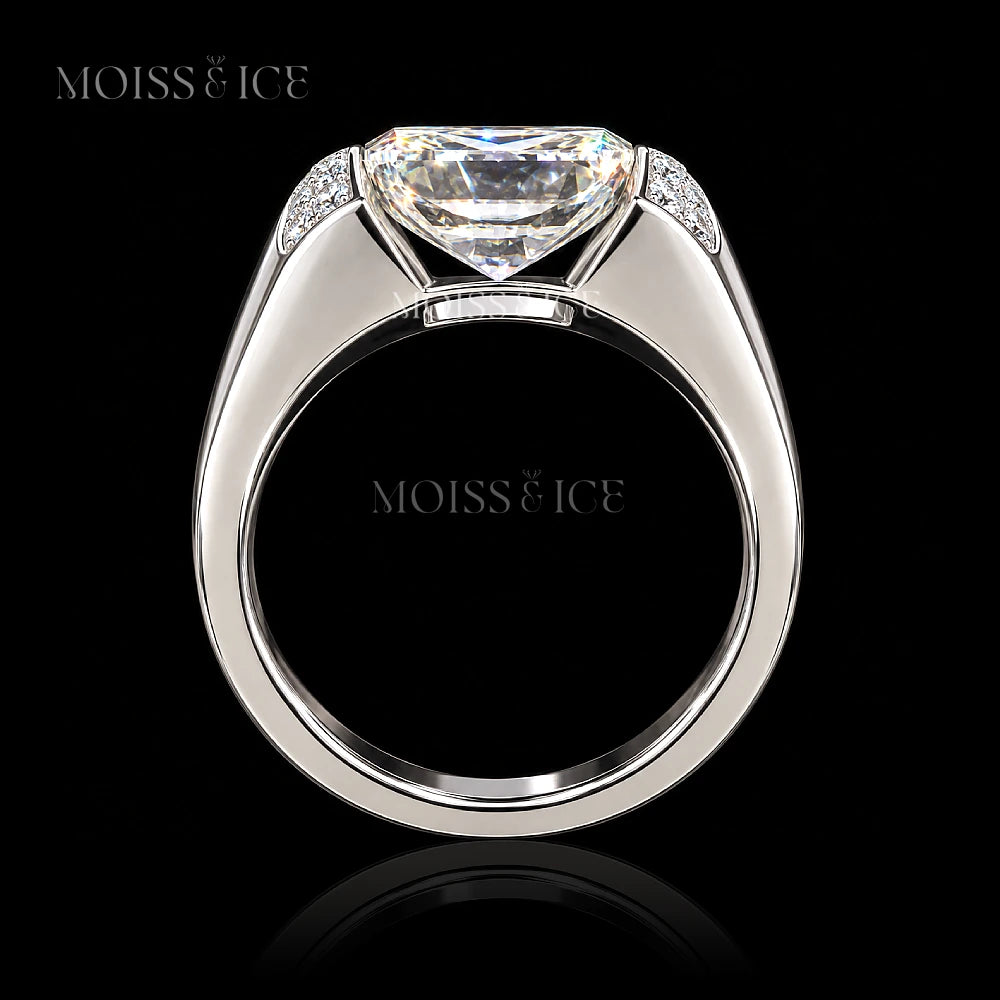 Side view - A Moiss & Ice bold statement mens ring featuring a 5 carat rectangular radiant-cut vvs moissanite center stone in a polished white gold setting with smaller accent round moissanite stones on the shoulders - the Raj