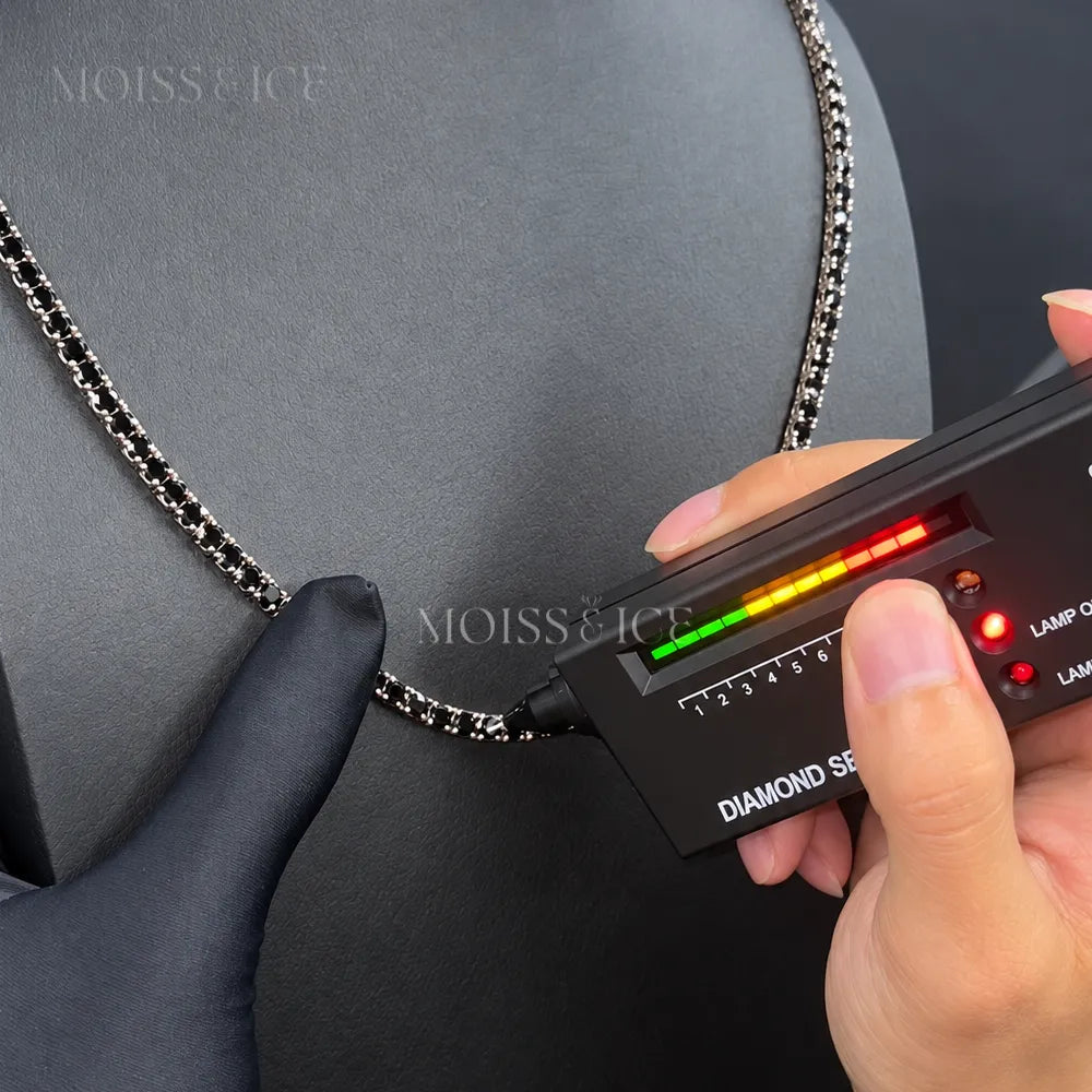 Our black moissanite passing a diamond tester.