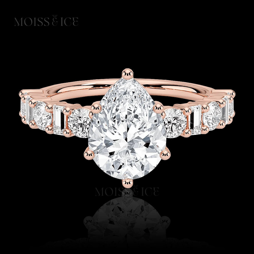 pear cut moissanite engagement ring with a pavé band of alternating baguette and round cut moissanite  stones in Silver or 14k and 18k gold - The Chahat by Moiss and Ice Canada