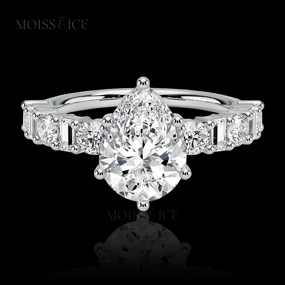 pear cut moissanite engagement ring with a pavé band of alternating baguette and round cut moissanite  stones in Silver or 14k and 18k gold - The Chahat by Moiss and Ice Canada