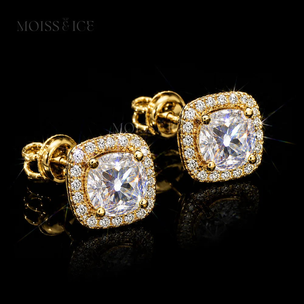 A pair of square cushion-cut stud earrings featuring large moissanite round-cut center stones surrounded by a halo of small clear pavé moissanite stones, set in 925 silver and finished in 18k yellow gold by Moiss and Ice Canada