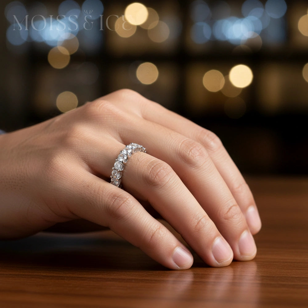 close up of a male hand wearing round cut eternity moissanite ring from Moiss and Ice Canada - model the Pyaar