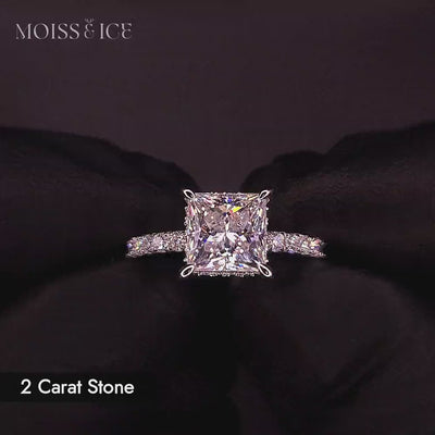 Video of a 2 carat princess cut moissanite engagement ring with pave band and hidden halo in white gold
