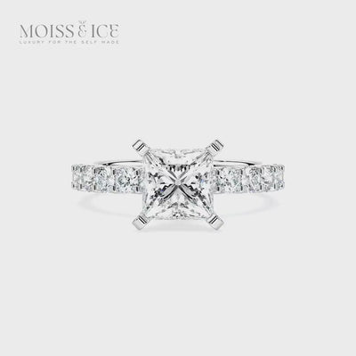 video spin of our moissanite engagement ring with a princess cut stones on a pave band