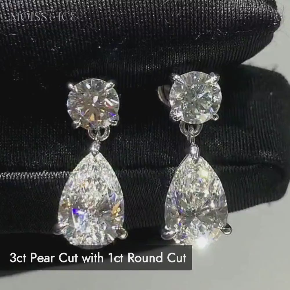 Close up video showing the sparkling and quality workmanship of this pair of sparkling Moiss & Ice pear drop earrings featuring round brilliant-cut moissanite studs and pear-cut moissanite drops in white gold settings.
