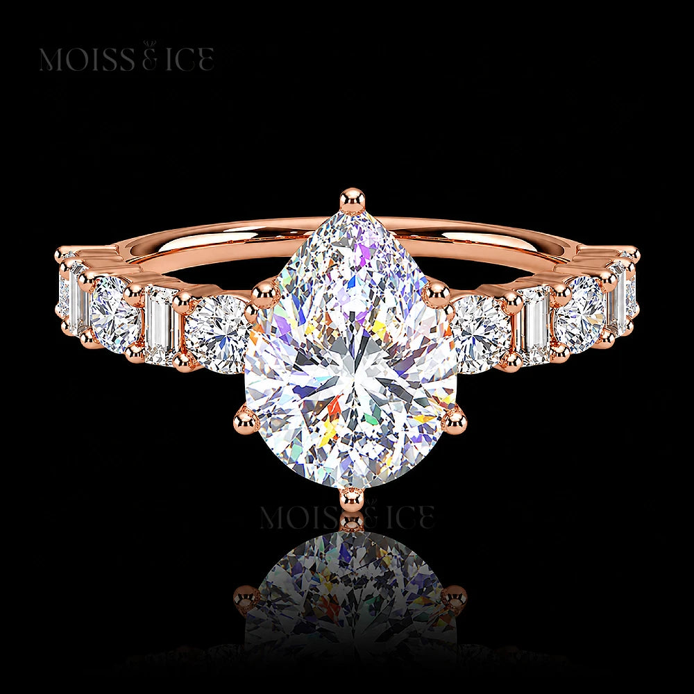 pear cut moissanite engagement ring with a pavé band of alternating baguette and round cut moissanite  stones in 14k and 18k rose gold - The Chahat by Moiss and Ice Canada