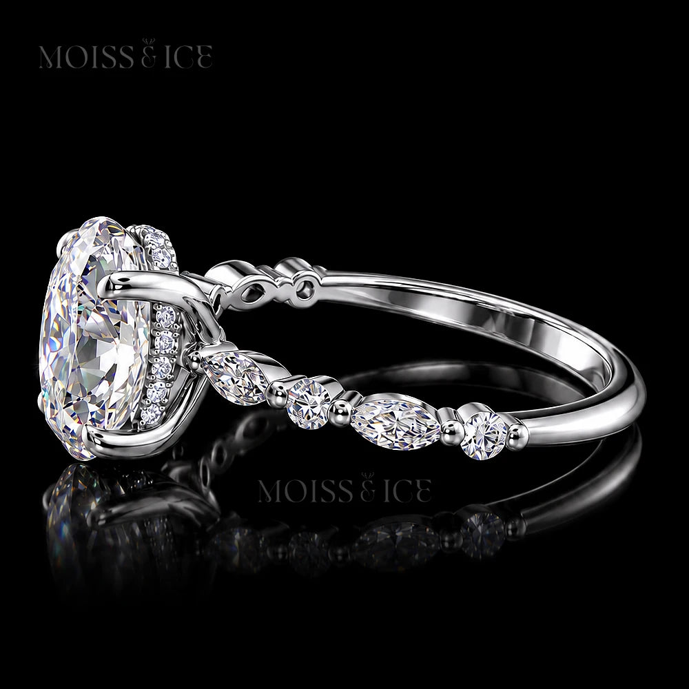 Side view of The Aishani white gold oval moissanite ring showing hidden halo and accent stones by Moiss & Ice Canada