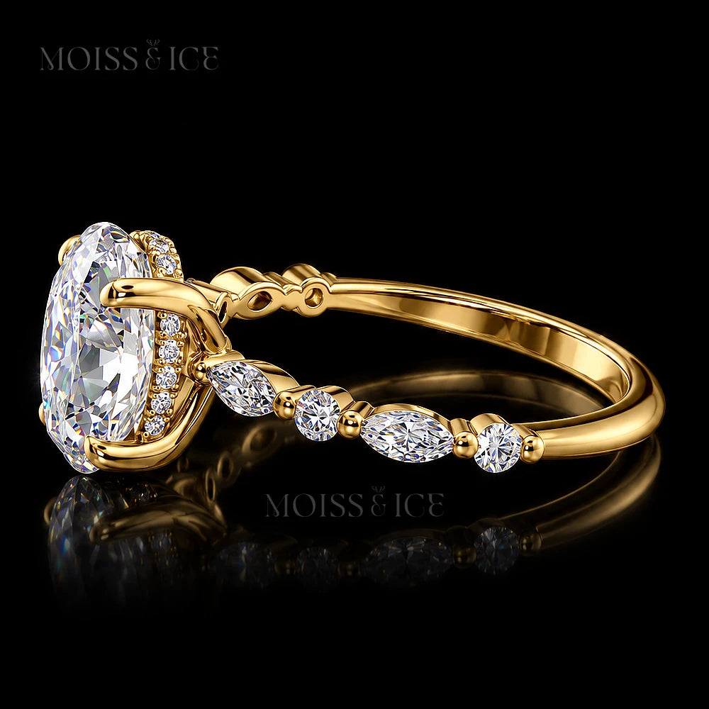 Profile view of The Aishani yellow gold oval lab-grown diamond engagement ring highlighting the hidden halo and marquise accent band