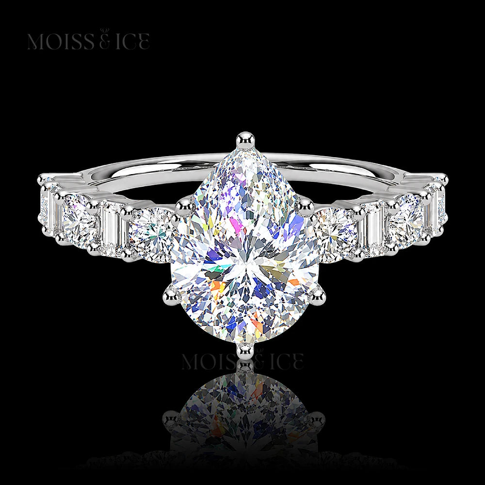 pear cut moissanite engagement ring with a pavé band of alternating baguette and round cut moissanite  stones in 14k and 18k white gold - The Chahat by Moiss and Ice Canada