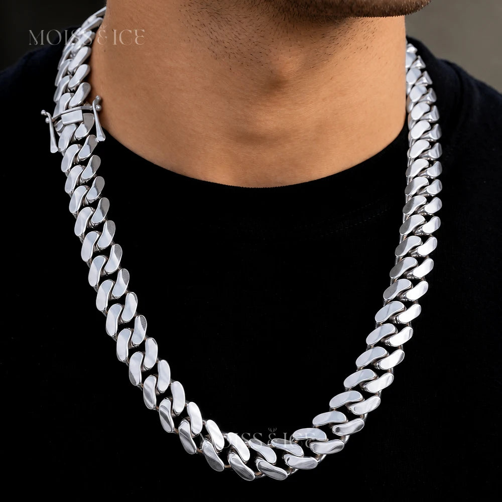 Close of a man wearing a large white gold cuban link chain by Moiss and Ice Canada